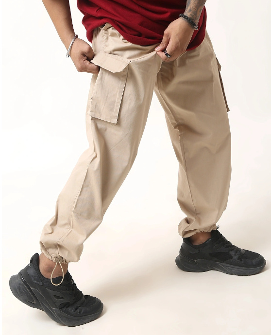model wearing Parachute pants for Orange T-shirt Combination.