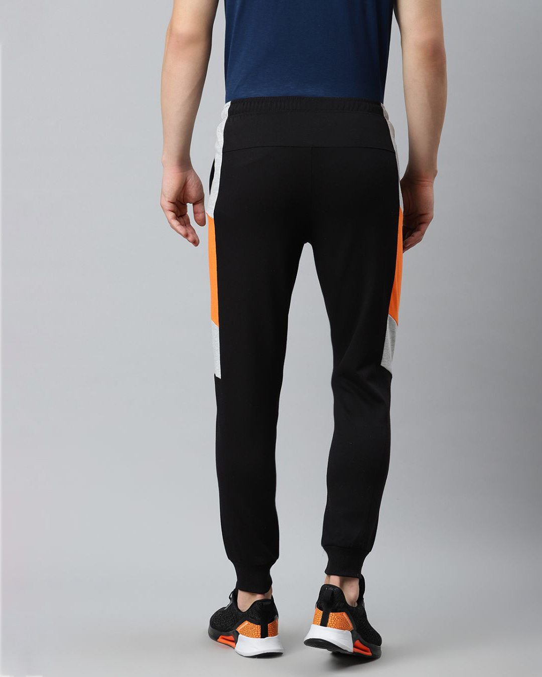 Shop Men Black Solid Slim Fit Mid Rise Joggers-Back