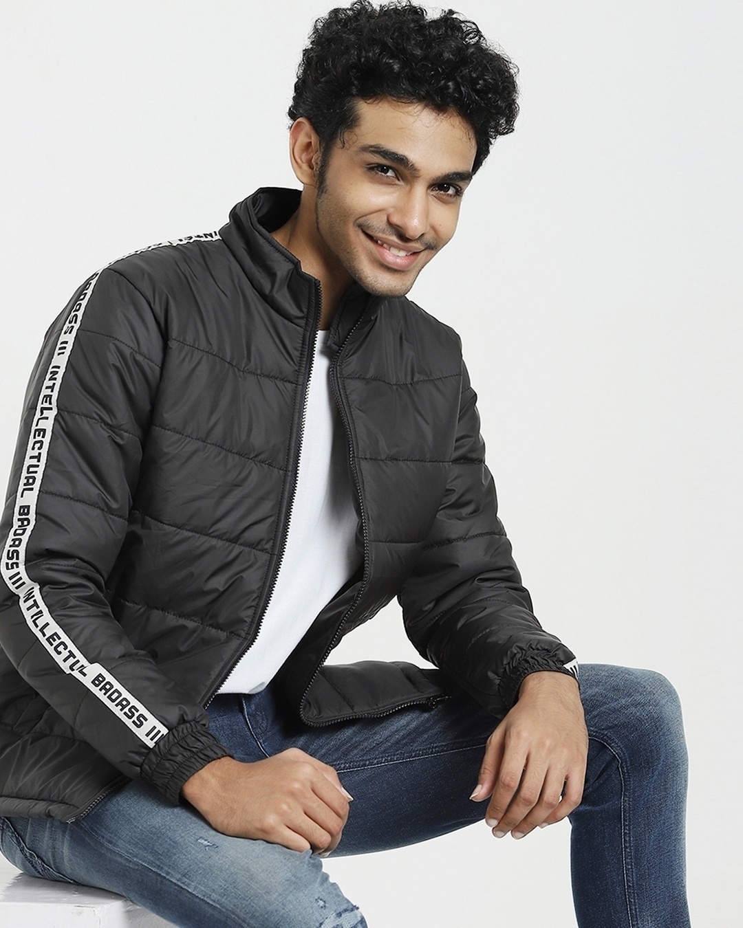 man styled a black jackets with white t-shirt and jeans