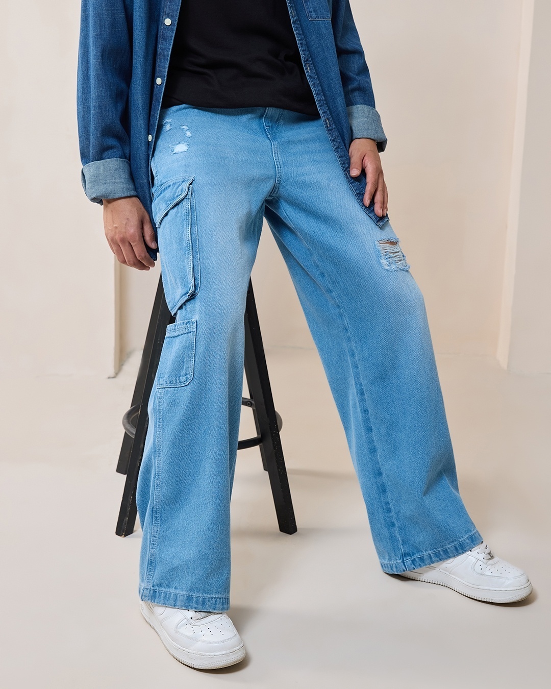 Model wearing baggy pants with Navy Blue T-shirt
