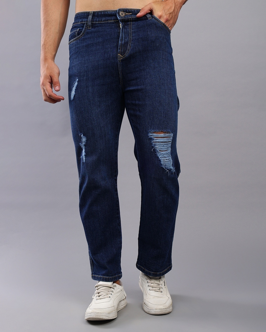 man styled acid wash denim with sneakers
