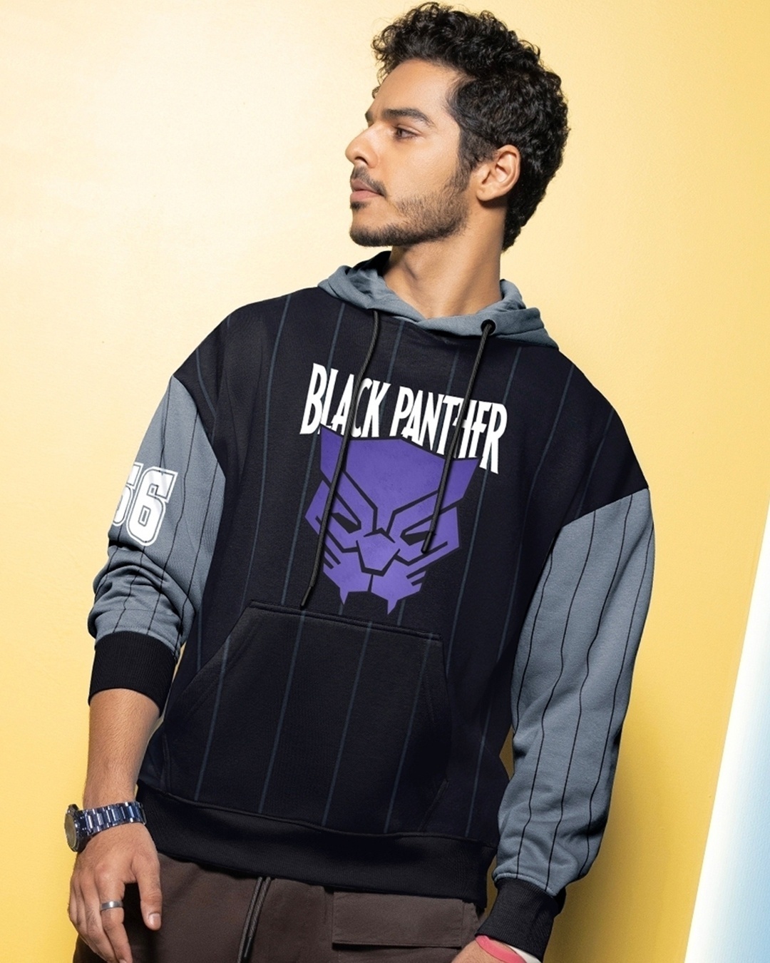 man posing with black panther hoodie with stylish watch