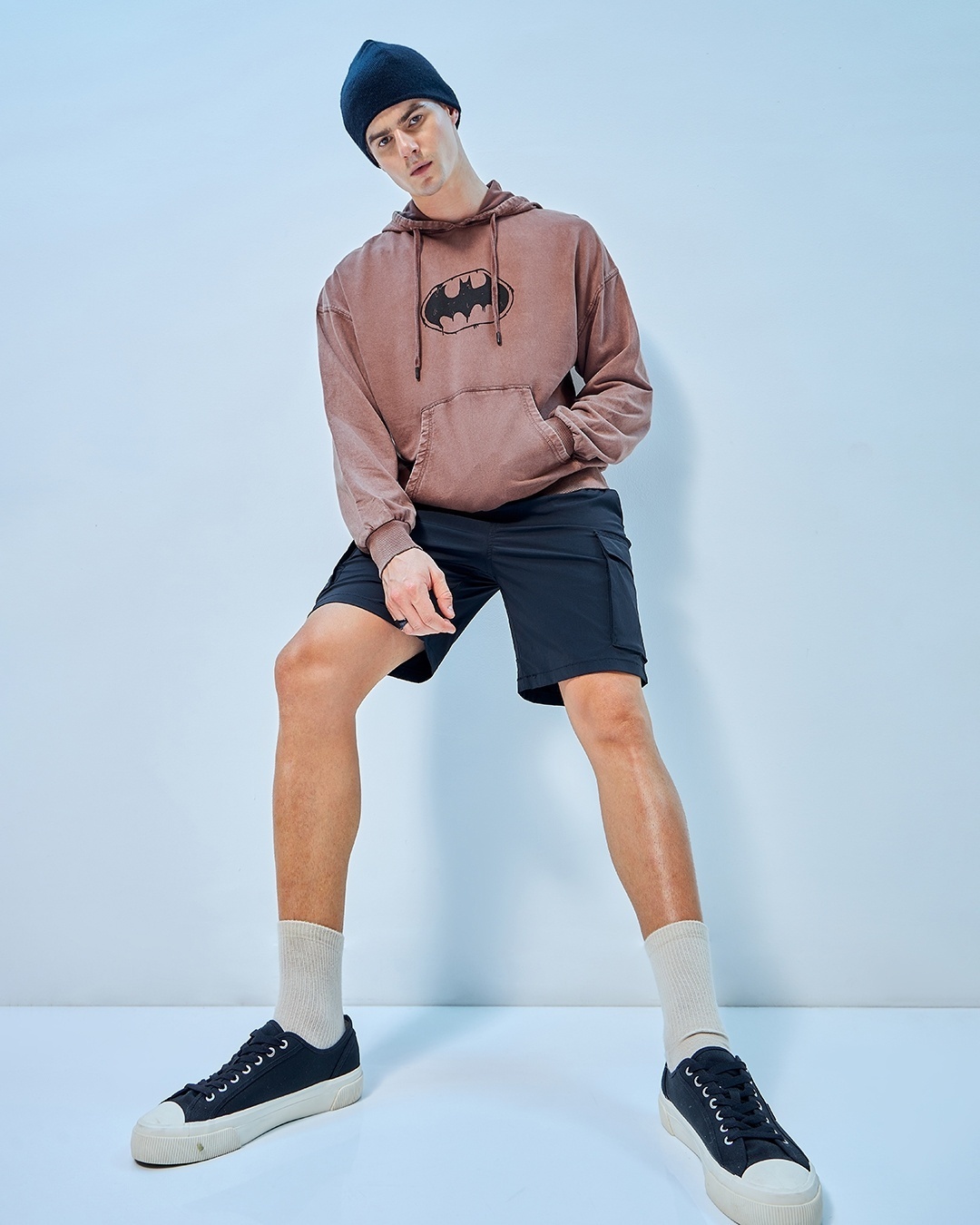 man styled a oversized hoodie with shorts