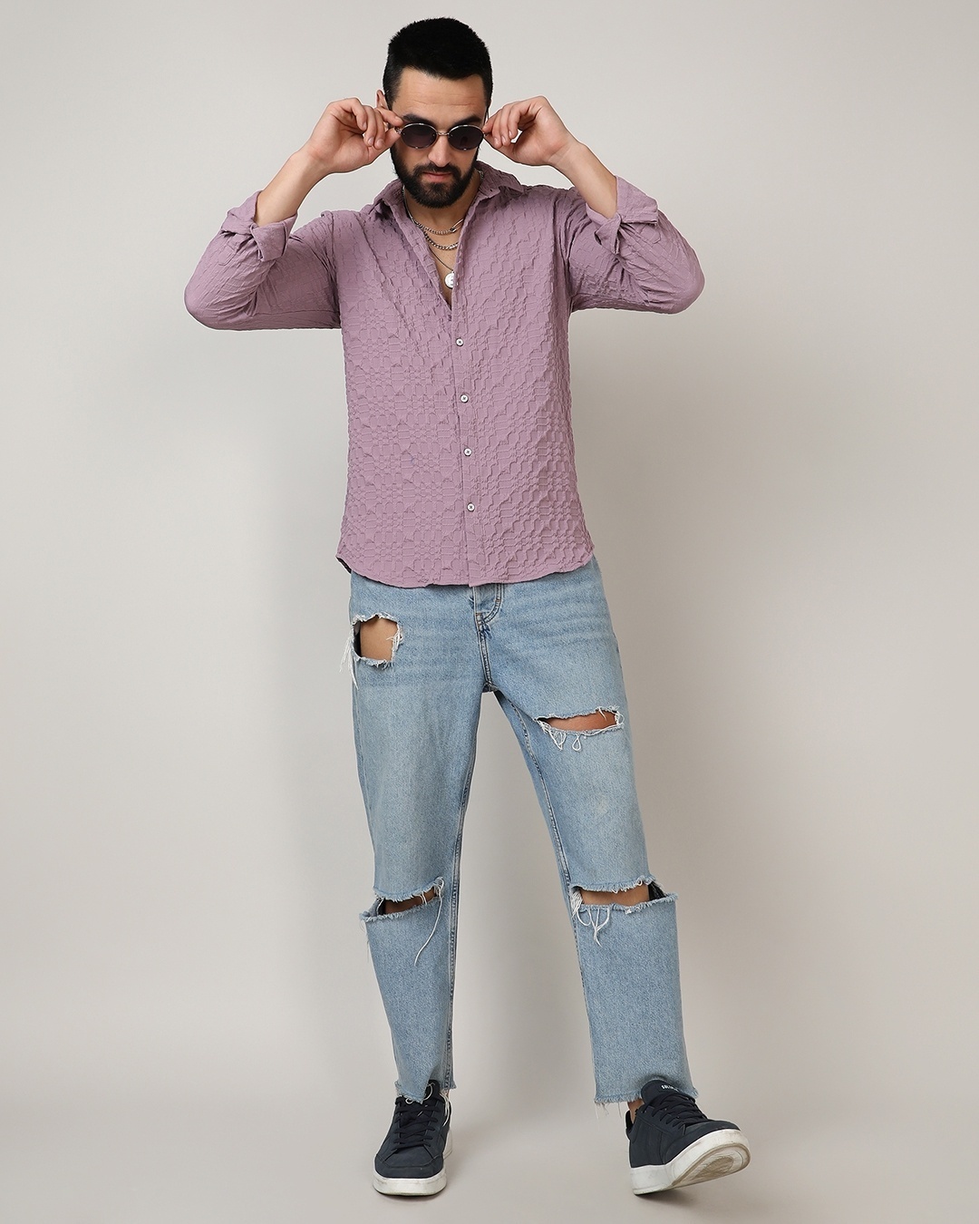 man wearing Purple shirt with blue jean