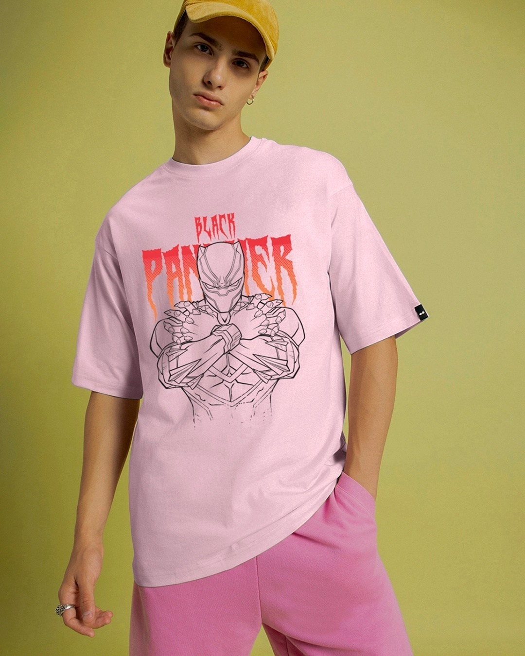 man paired pink black panther t-shirt with yellow cap