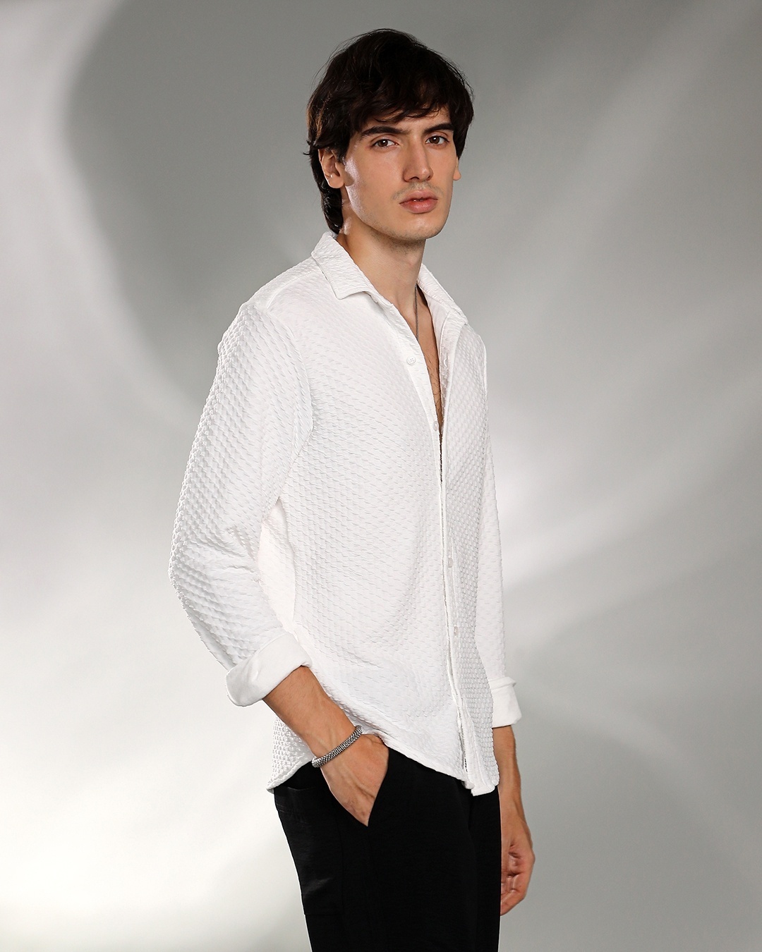 man styled a white shirt with black pants