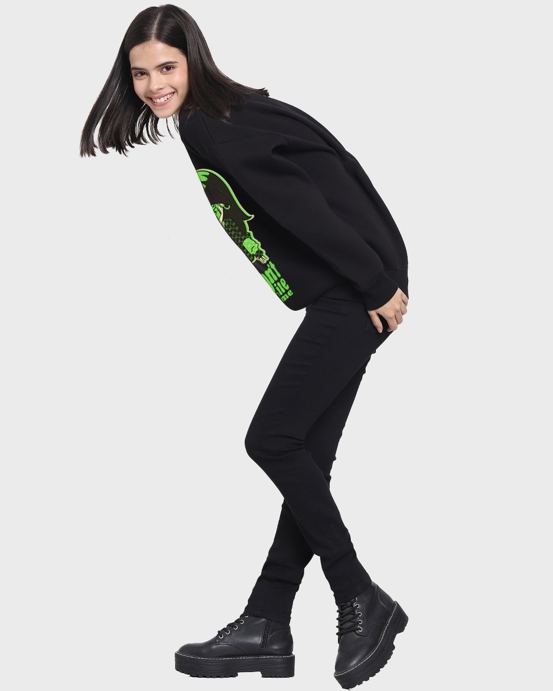 woman styled a black sweatshirt with pant and shoe