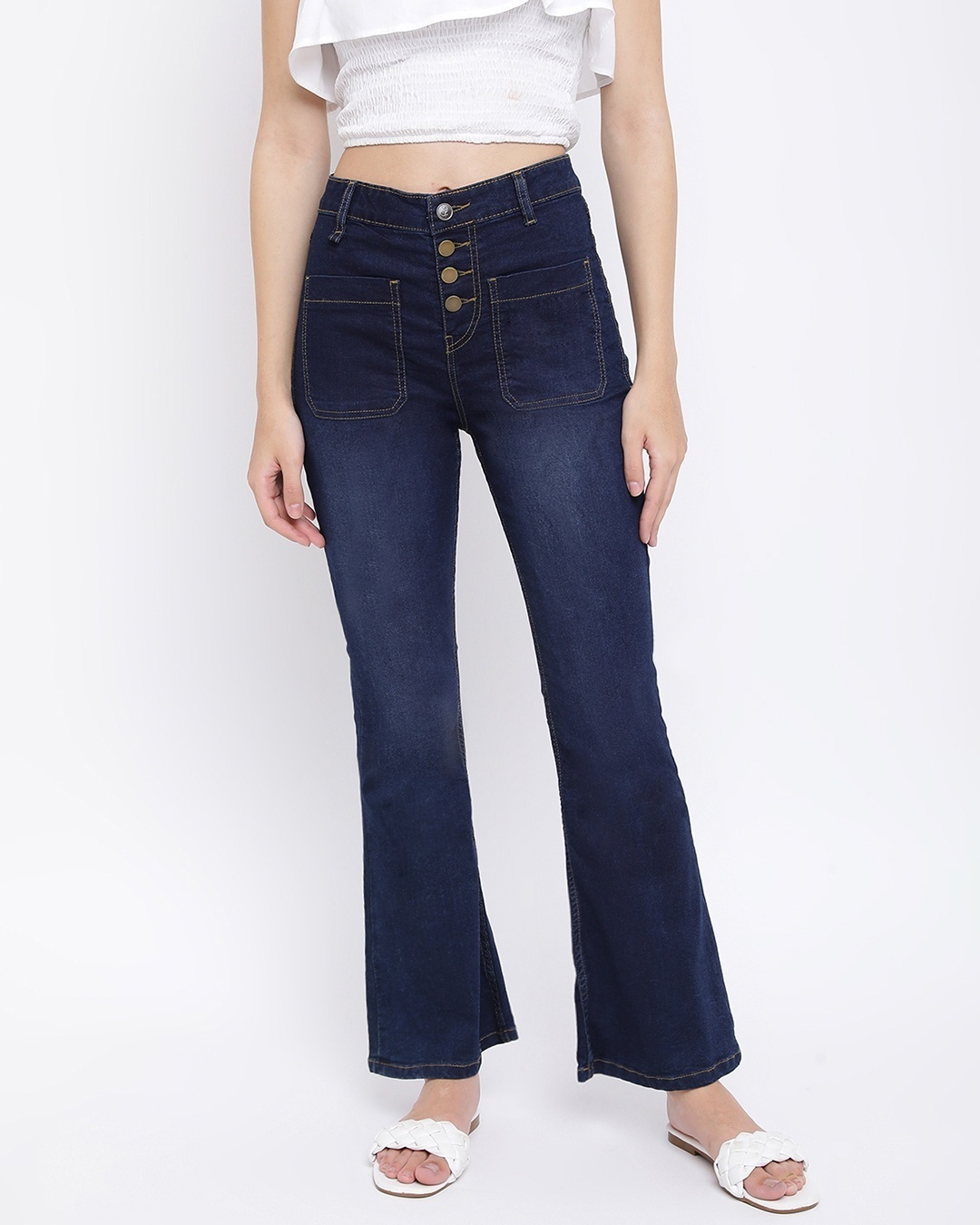 woman styled a wide leg jean with slipper