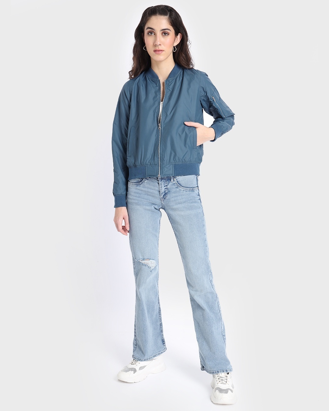 women styled a blue jacket with jean