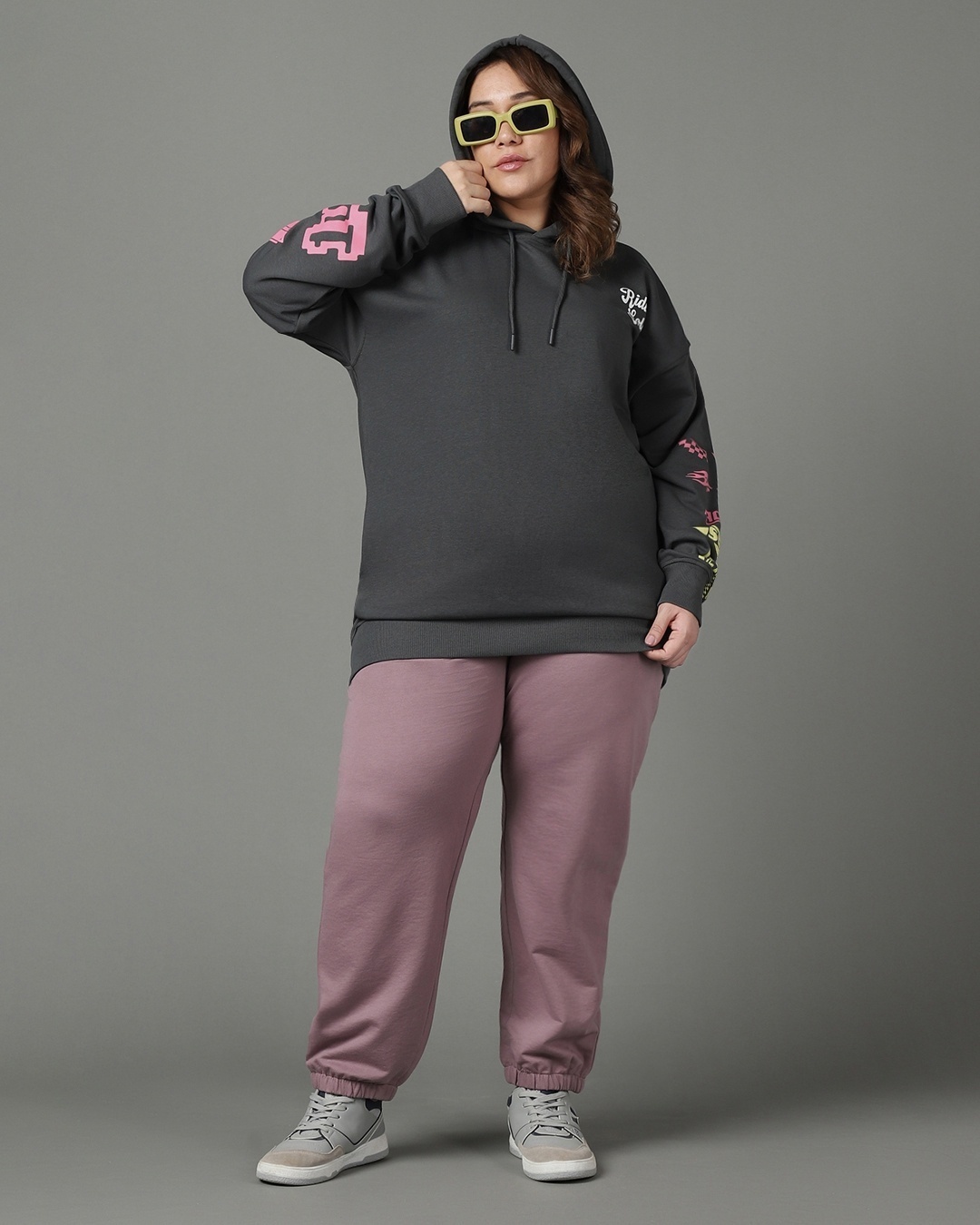 woman paired a grey hoodie with pant