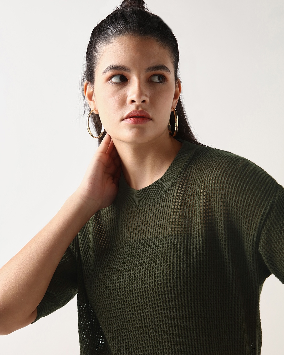 women wearing olive t-shirt/ top