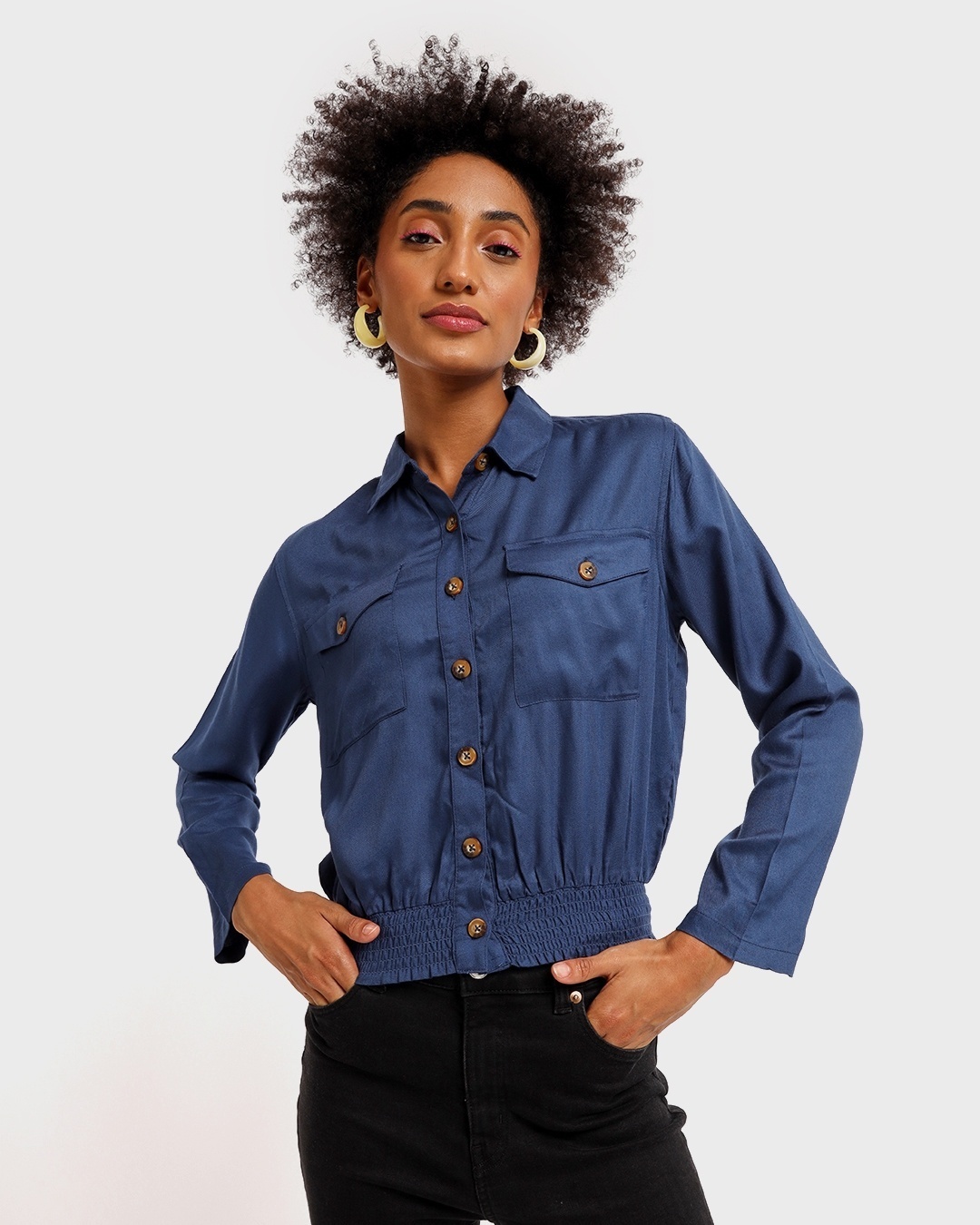 woman wearing a blue shirt with black pant