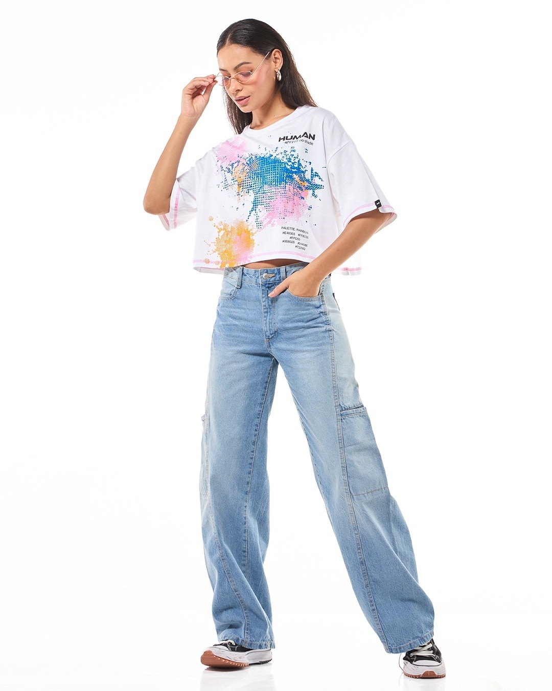 woman paired a white top with blue jean