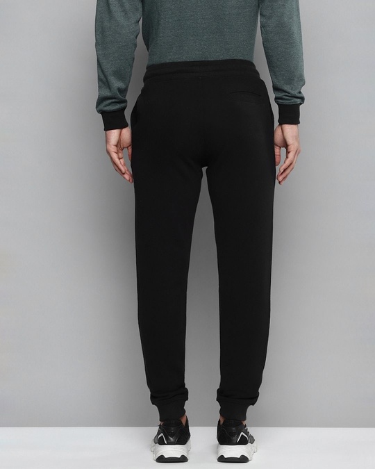 Shop Men Black Solid Slim Fit Joggers With Printed Detail-Back