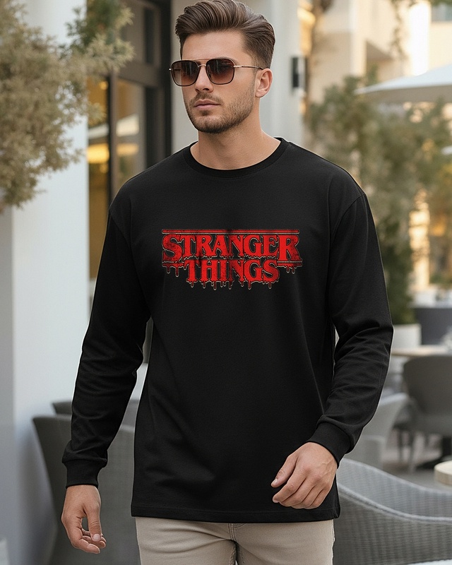Shop Men's Jet Black Stranger Things Logo Typography Oversized T-shirt-Front