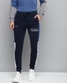 Shop Men Navy Blue Solid Slim Fit Joggers With Printed Detail-Front