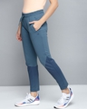 Shop Women Blue Solid Slim Fit Track Pants With Printed Detail-Design