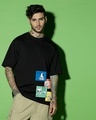 Shop Men's Black Snoopy Stripboard Graphic Printed Oversized T-shirt-Front