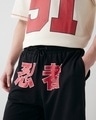 Shop Men's Black & White Akatsuki Typography Oversized Varsity Shorts