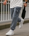 Shop Men's Charcoal Grey Melange Hogwarts Graphic Printed Oversized Joggers-Front