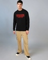Shop Men's Jet Black Stranger Things Logo Typography Oversized T-shirt