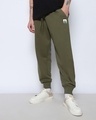 Shop Men's Olive Green Minion Badge Printed Oversized Joggers-Front