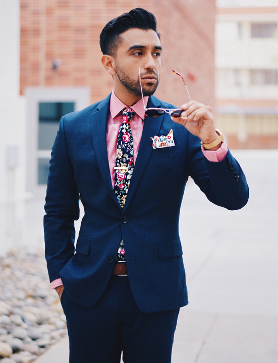 blue suit and purple shirt