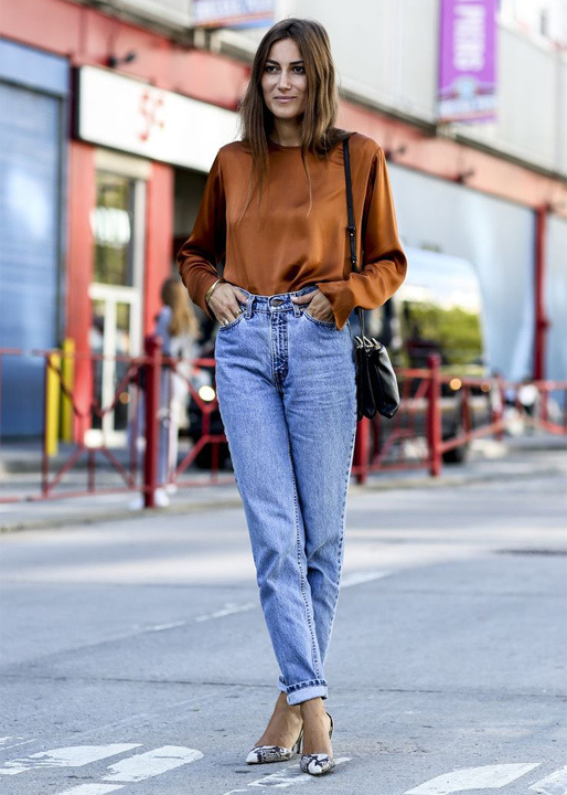 long sleeve black crop top paired with blue boyfriend jeans