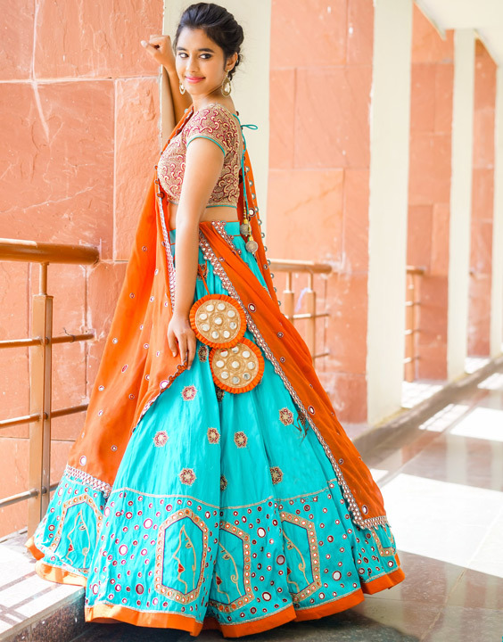 Photo of Engagement look with teal net lehenga with off shoulder blouse