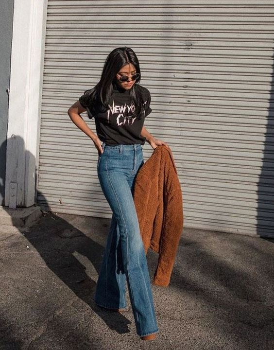 Young stylish brunette girl on shirt, pants, jeans jacket posed background  iron fence. Street fashion model concept. 6631462 Stock Photo at Vecteezy